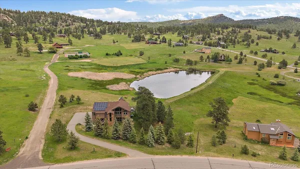a view of a swimming pool with a yard