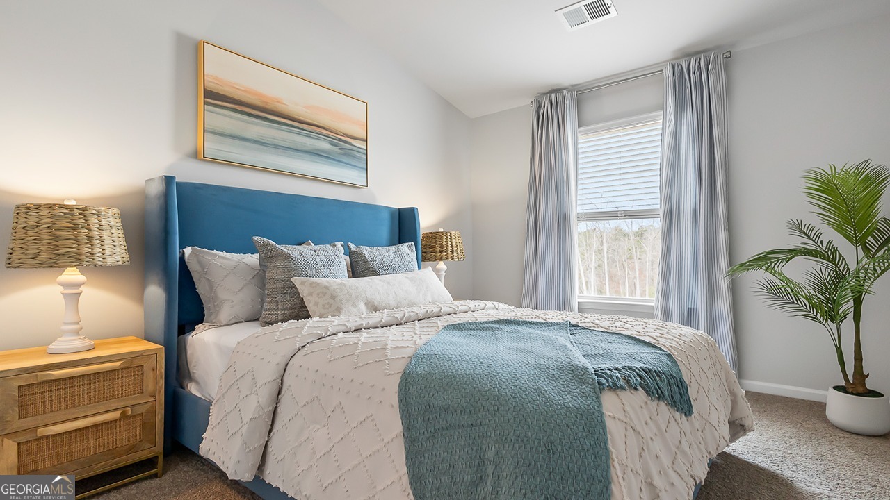 266 Pasture Lane Statesboro, GA 30461 - Photo 16 of 19 a bedroom with bed and a potted plant