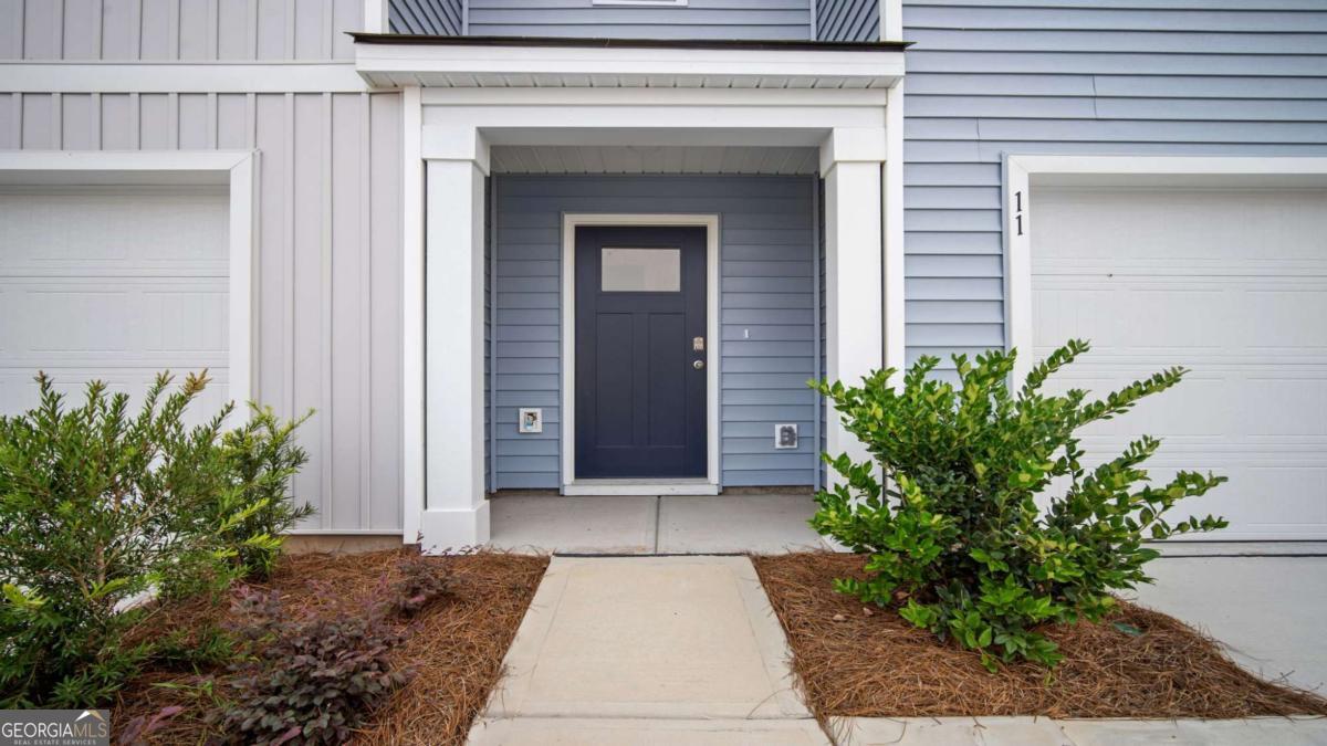 266 Pasture Lane Statesboro, GA 30461 - Photo 4 of 6 a entryway with a potted plant in front of door