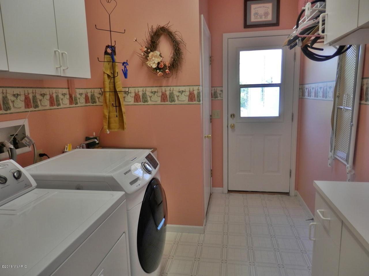 22296 Benton Road Mesick, MI 49668 - Photo 20 of 56 Light & airy main floor laundry