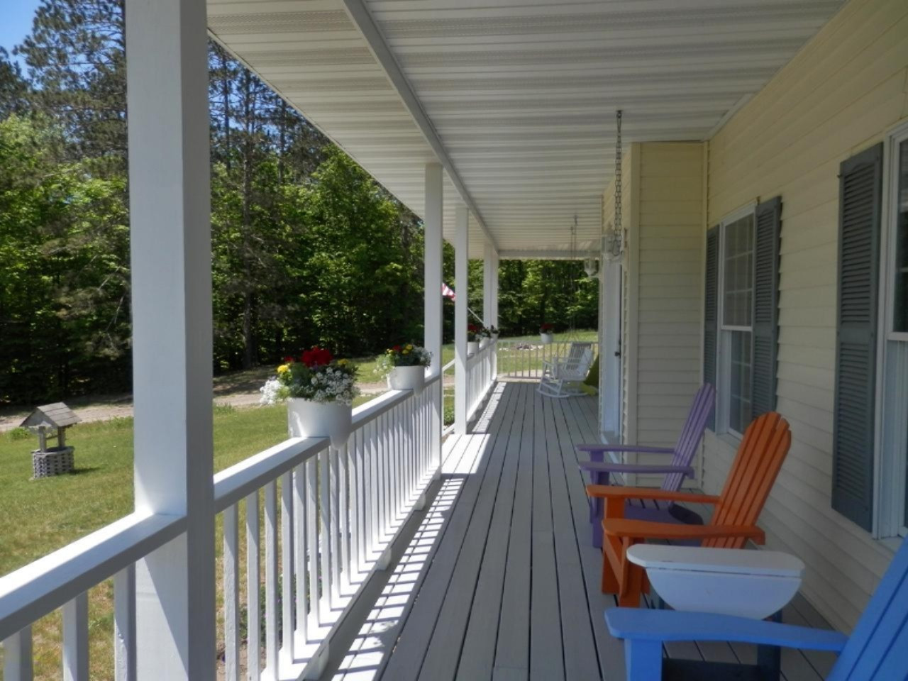 22296 Benton Road Mesick, MI 49668 - Photo 36 of 56 Covered front porch ready for relaxing