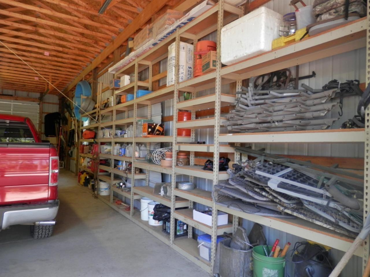 22296 Benton Road Mesick, MI 49668 - Photo 47 of 56 Extensive metal shelving to ceiling