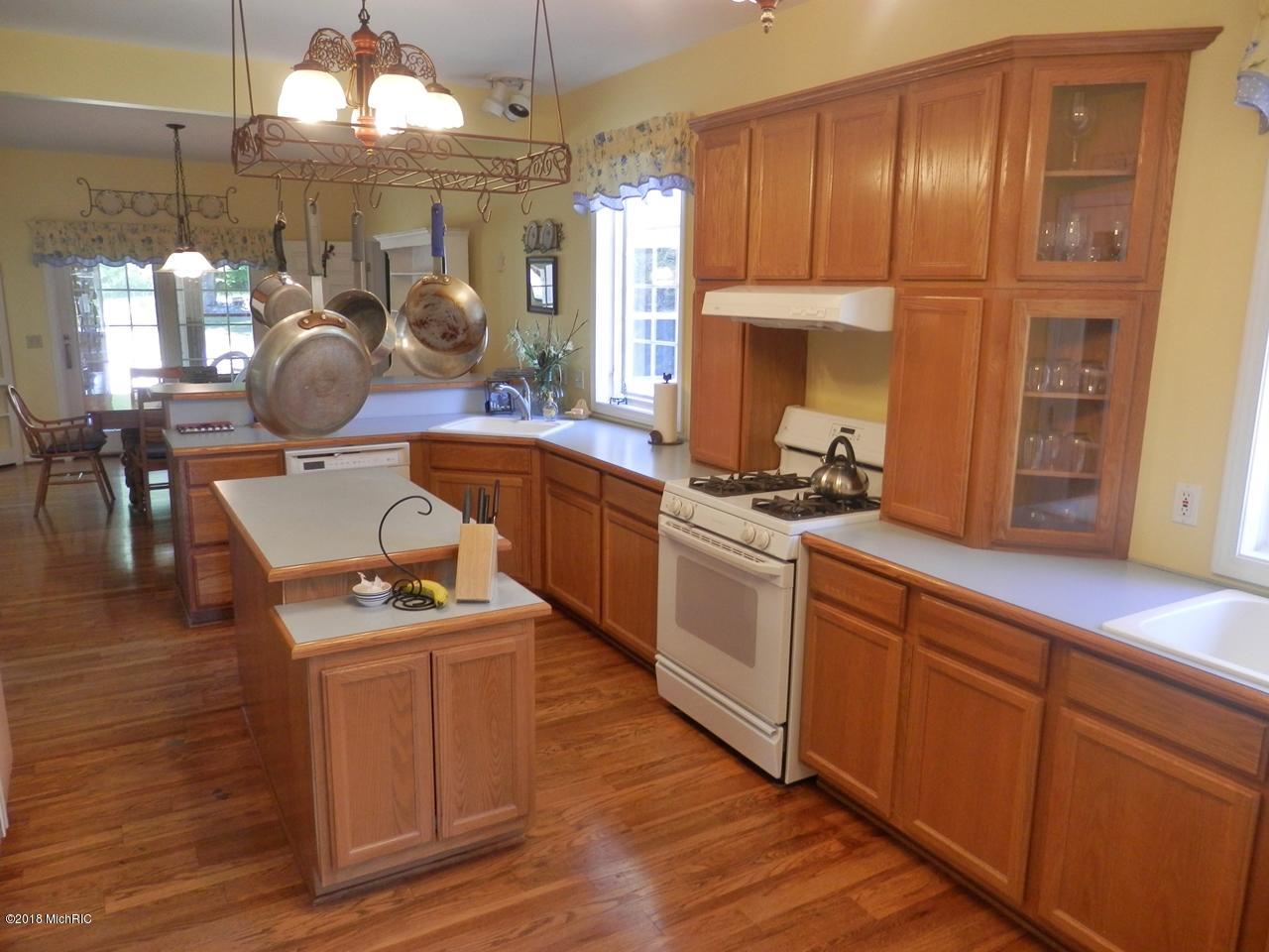 22296 Benton Road Mesick, MI 49668 - Photo 8 of 56 Island kitchen with wood floors
