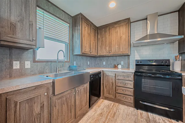 a kitchen with a sink stove top oven and cabinets