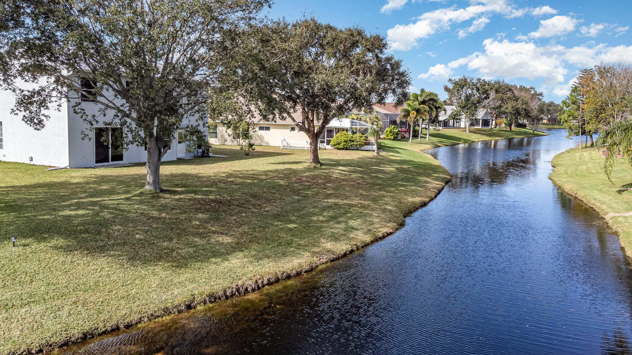 964 Shaw Circle Melbourne, FL 32940 - Photo 2 of 54 a view of a yard with large trees