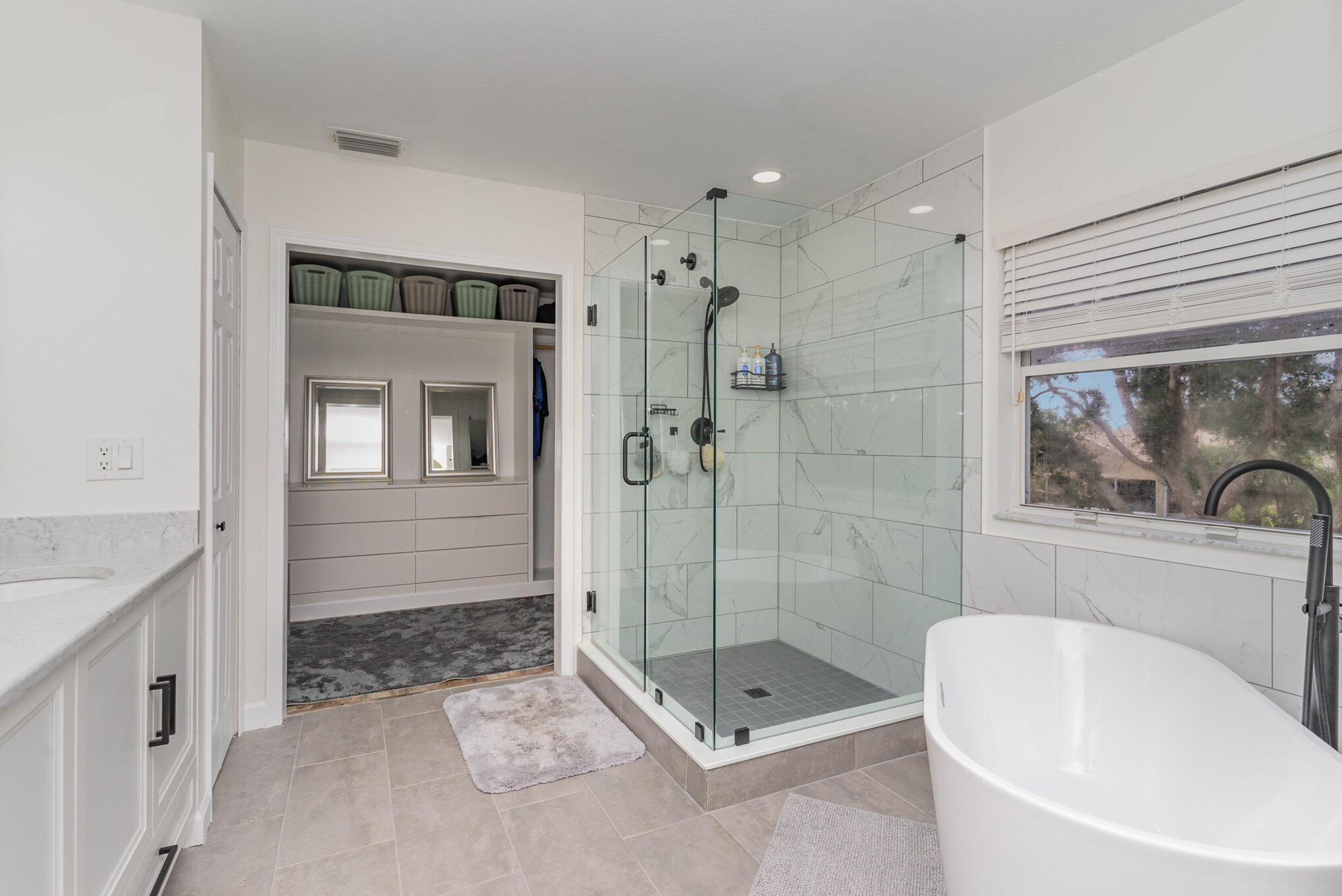 964 Shaw Circle Melbourne, FL 32940 - Photo 21 of 54 a bathroom with a bathtub and a shower