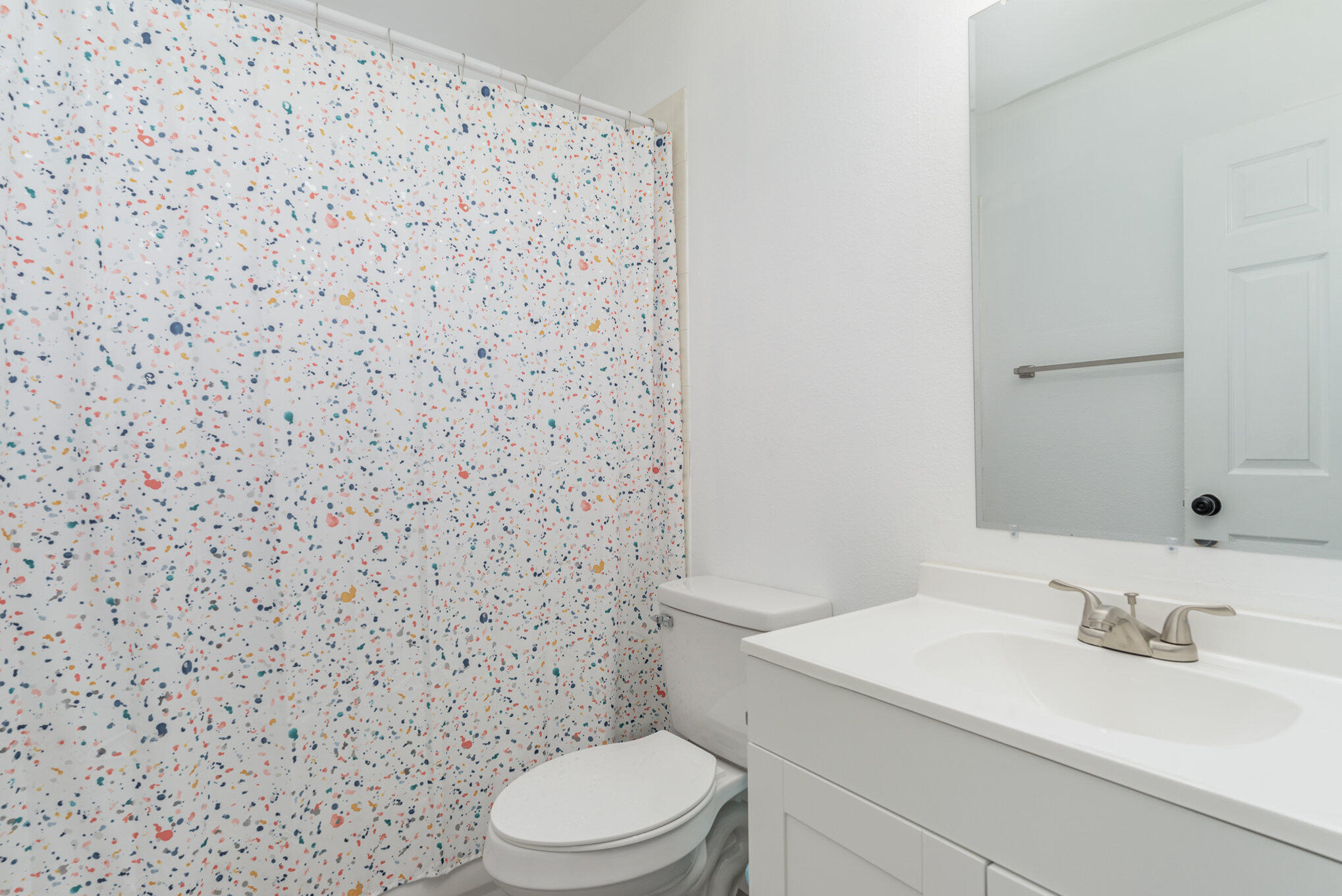 964 Shaw Circle Melbourne, FL 32940 - Photo 29 of 54 a bathroom with a sink a toilet and a mirror