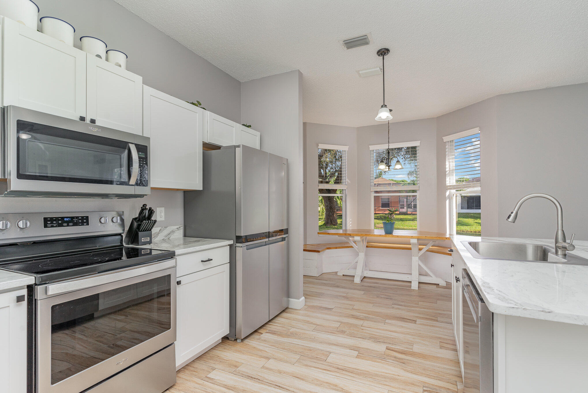 964 Shaw Circle Melbourne, FL 32940 - Photo 37 of 54 a kitchen with a refrigerator stove and sink