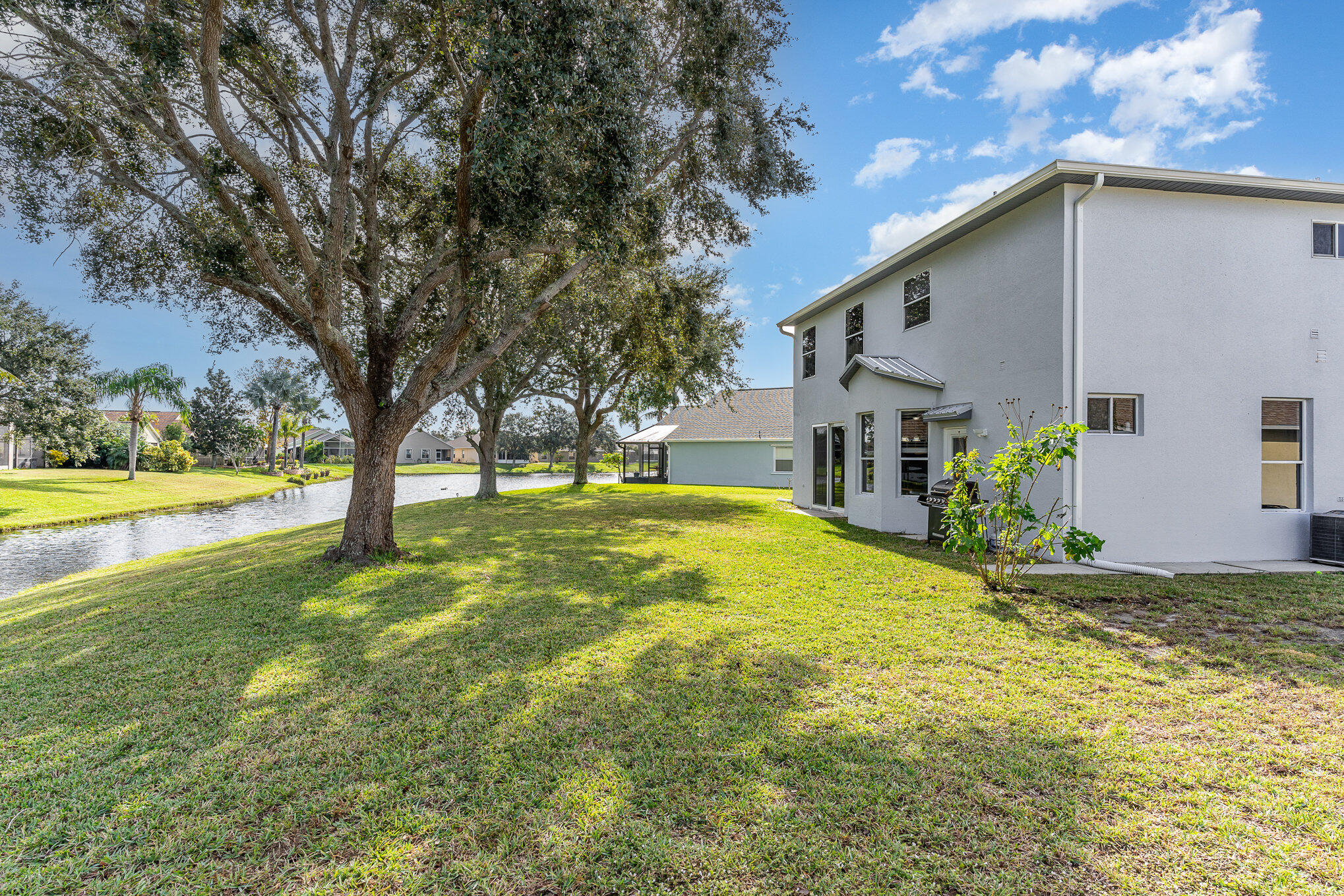 964 Shaw Circle Melbourne, FL 32940 - Photo 43 of 54 a house view with swimming pool in front of it