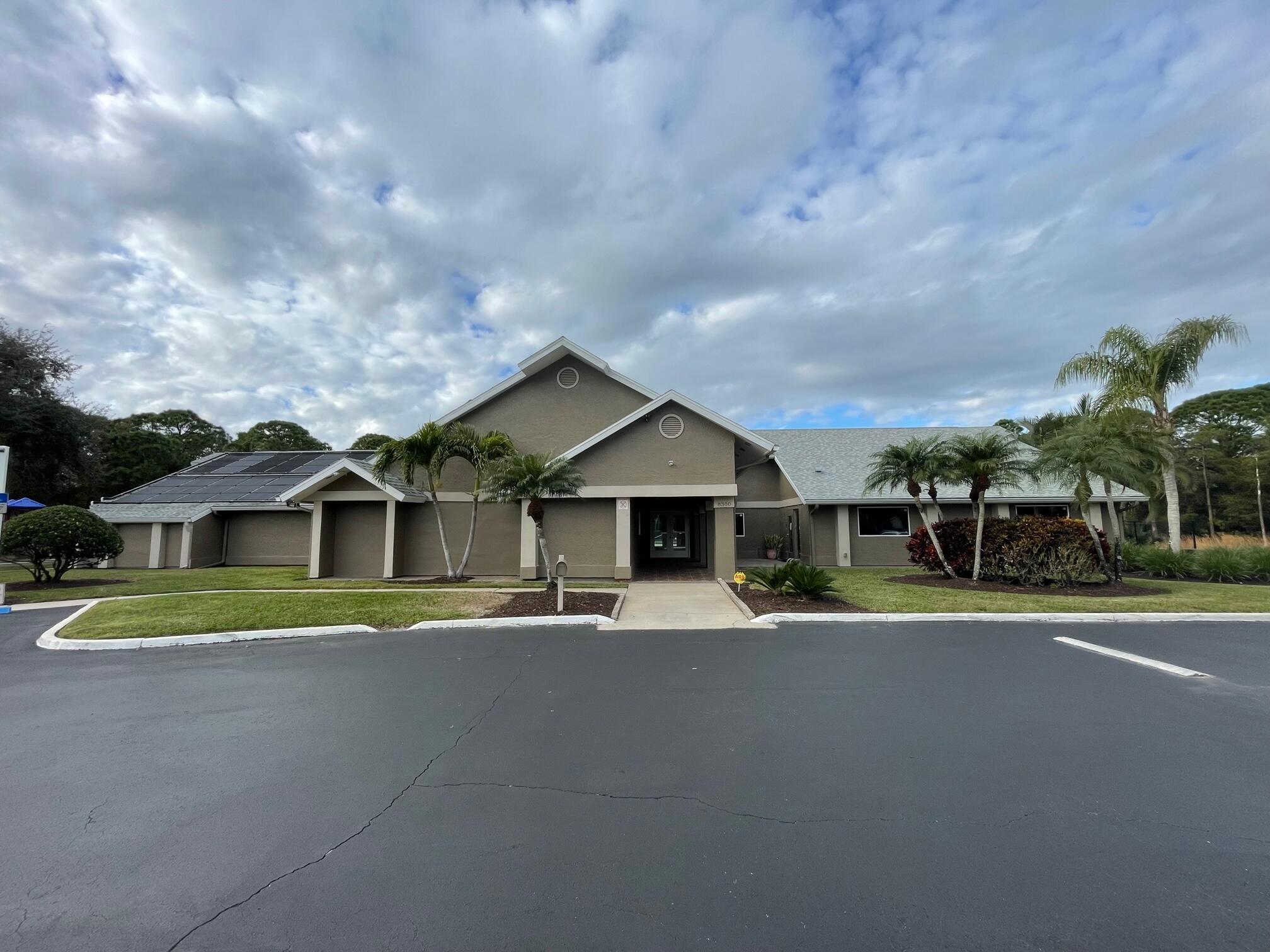 964 Shaw Circle Melbourne, FL 32940 - Photo 48 of 54 a front view of a house with a yard and garage