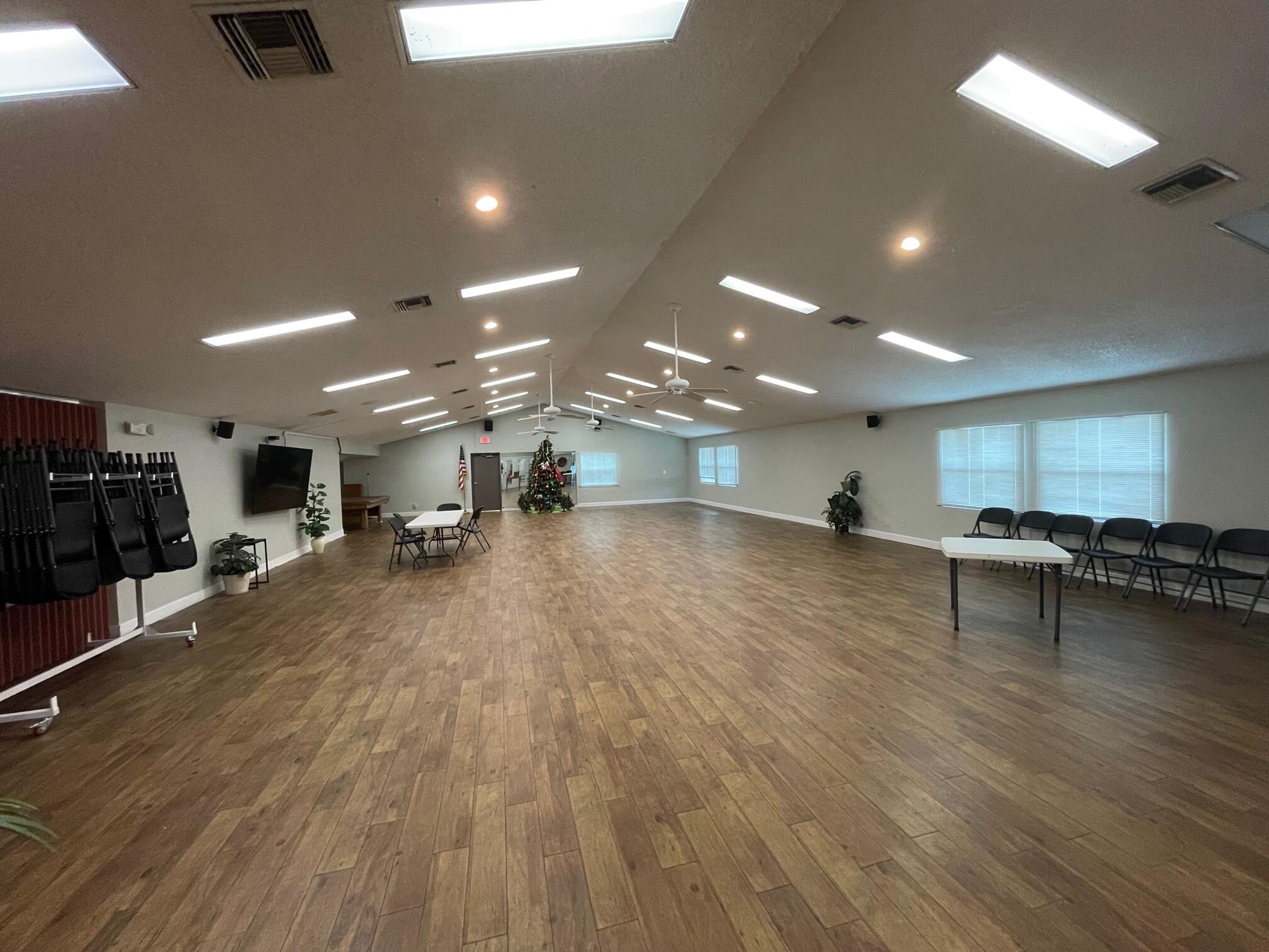 964 Shaw Circle Melbourne, FL 32940 - Photo 49 of 54 a view of a room with gym equipment and a large window