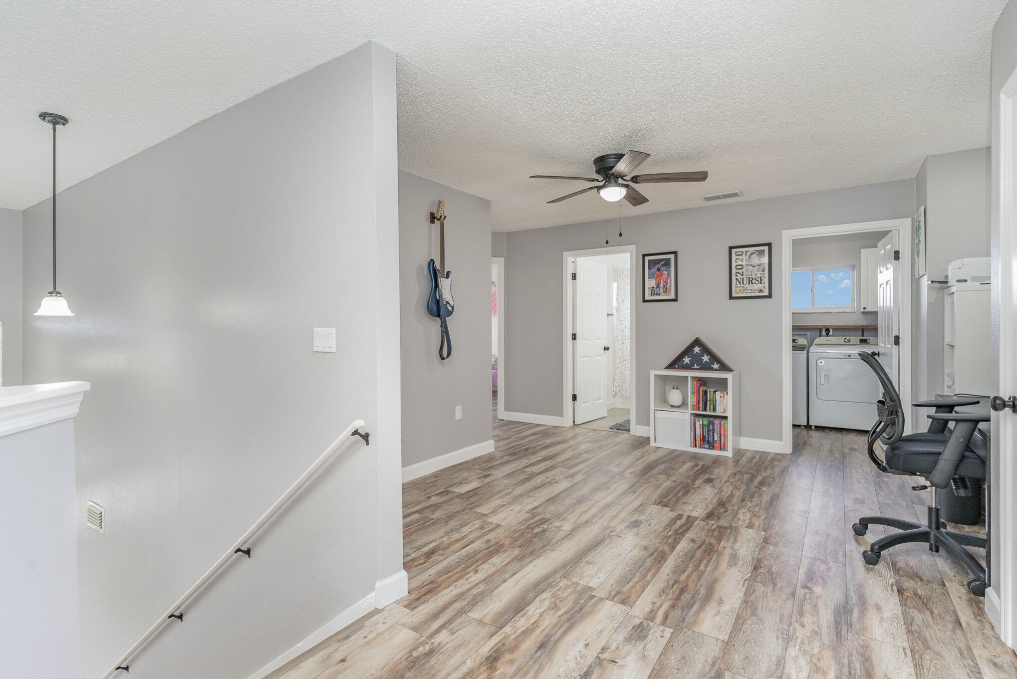 964 Shaw Circle Melbourne, FL 32940 - Photo 6 of 54 a view of a room with wooden floor and ceiling fan
