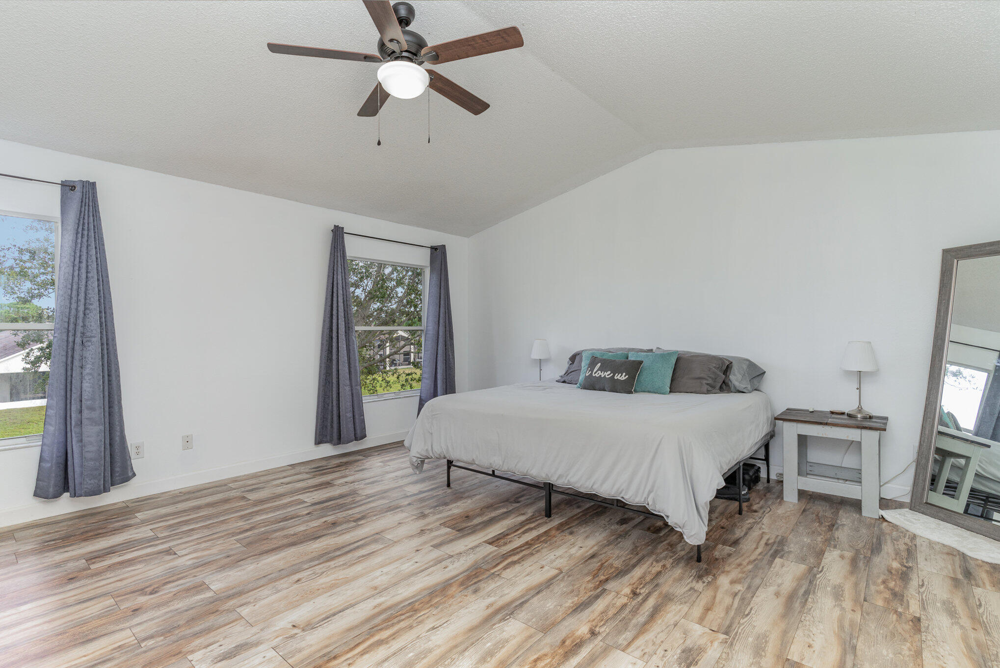 964 Shaw Circle Melbourne, FL 32940 - Photo 7 of 54 a bedroom with a bed dresser and a window