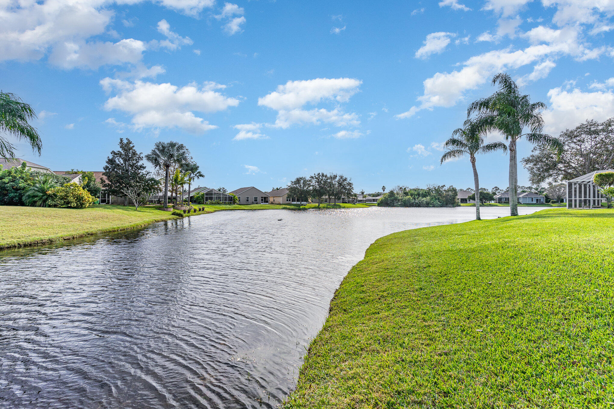 964 Shaw Circle Melbourne, FL 32940 - Photo 10 of 54 a view of a lake with a big yard