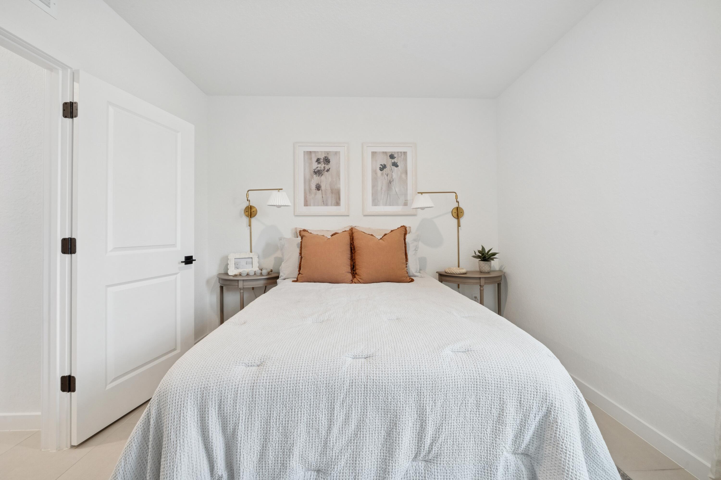 9732 Apollo Avenue, Unit 4 Fort Pierce, FL 34945 - Photo 13 of 39 a bedroom with a bed and a window