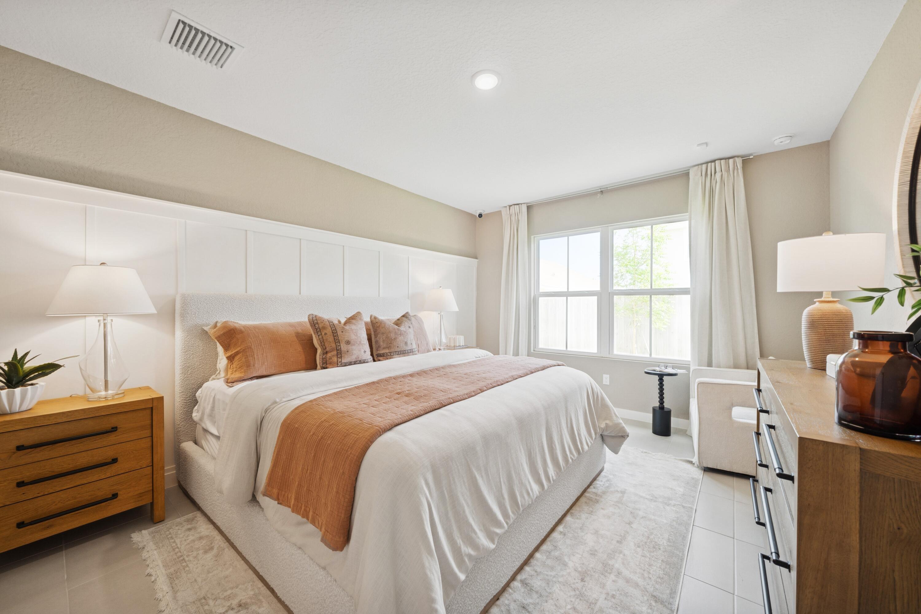 9732 Apollo Avenue, Unit 4 Fort Pierce, FL 34945 - Photo 30 of 39 a bedroom with a bed and a window