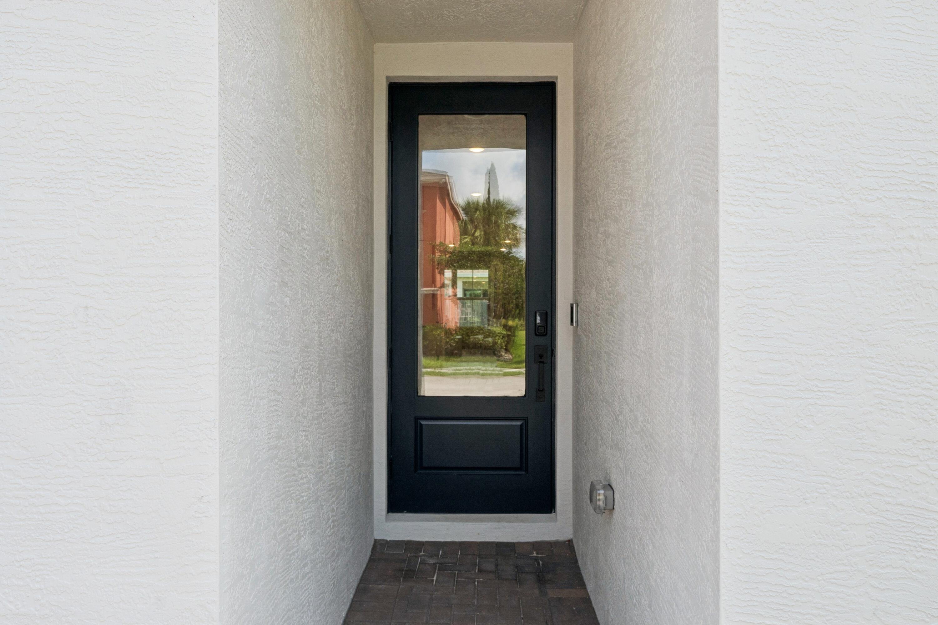 9732 Apollo Avenue, Unit 4 Fort Pierce, FL 34945 - Photo 3 of 39 a view of a front door