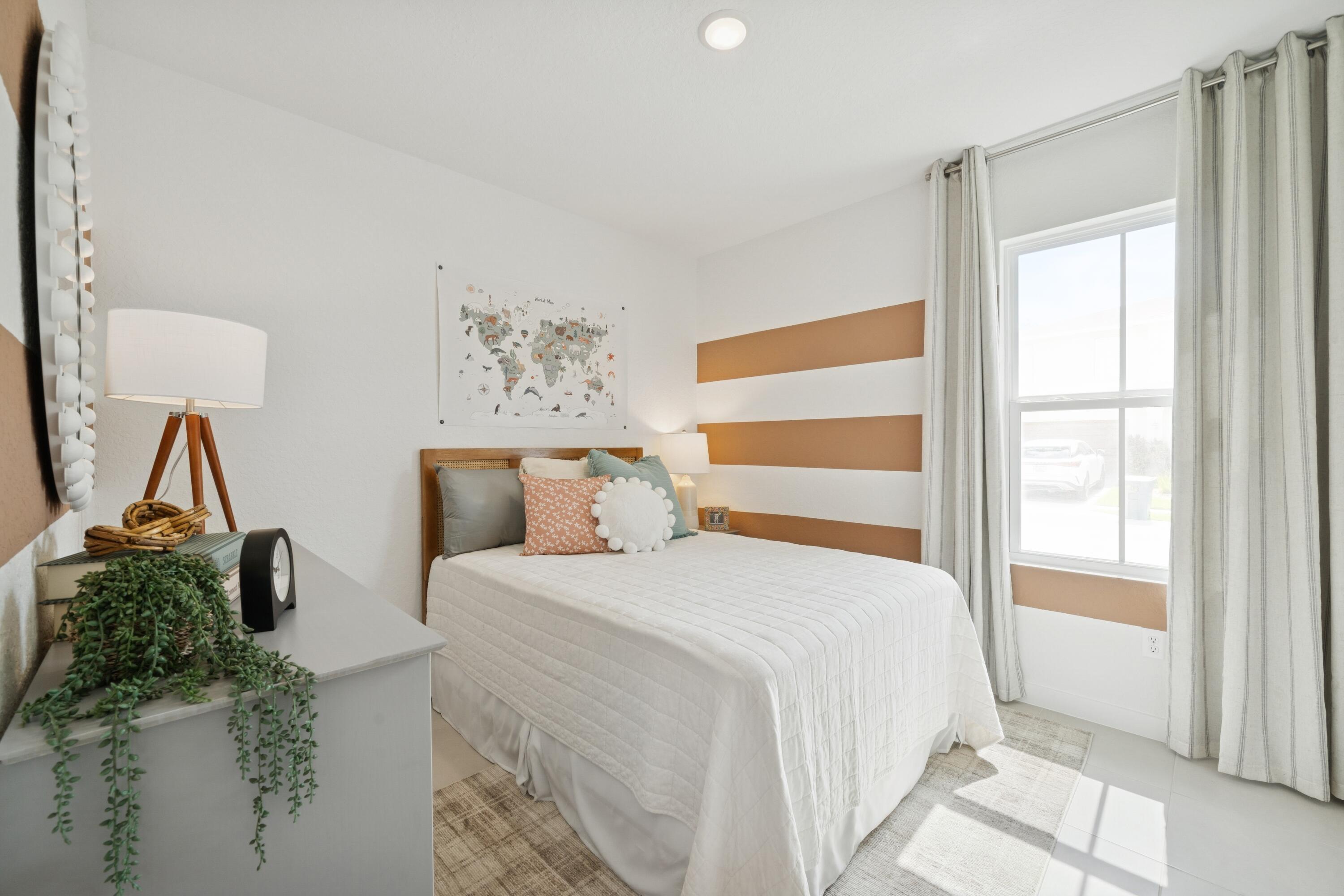 9732 Apollo Avenue, Unit 4 Fort Pierce, FL 34945 - Photo 5 of 39 a bedroom with a bed and a window