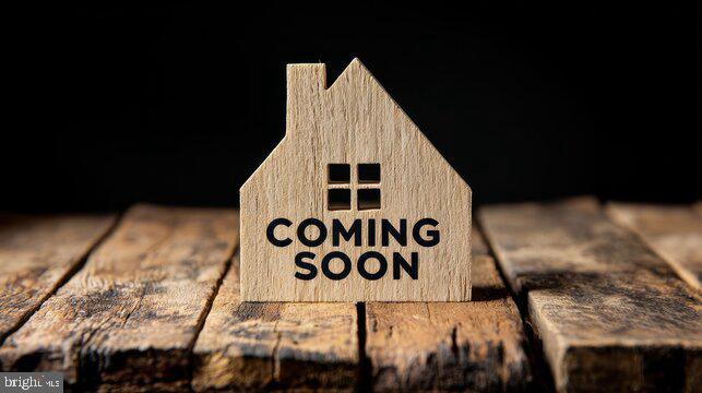 a view of a wooden house with a signage