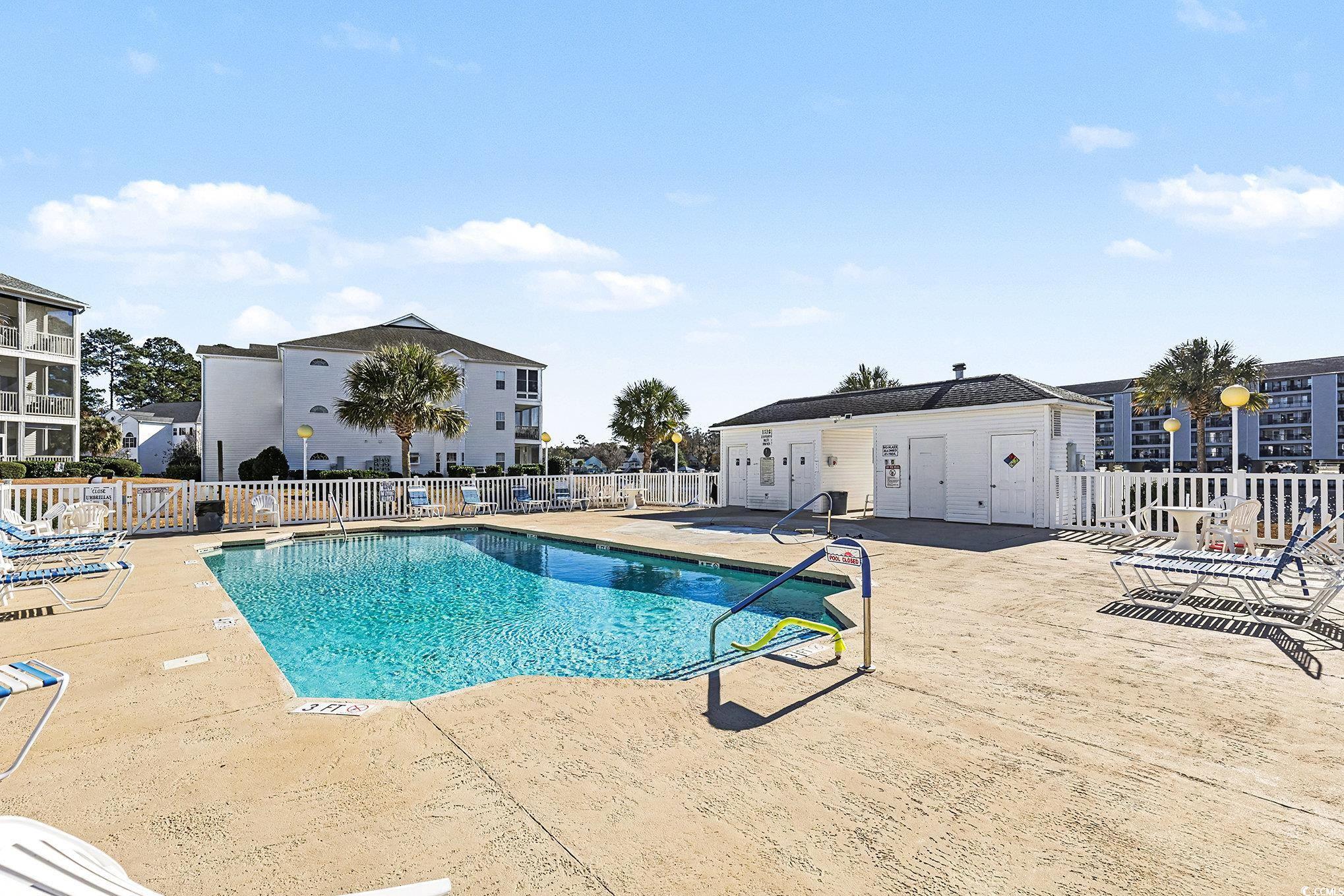 1512 Lanterns Rest Road, Unit 102 Myrtle Beach, SC 29579 - Photo 17 of 21 Community pool with a patio area