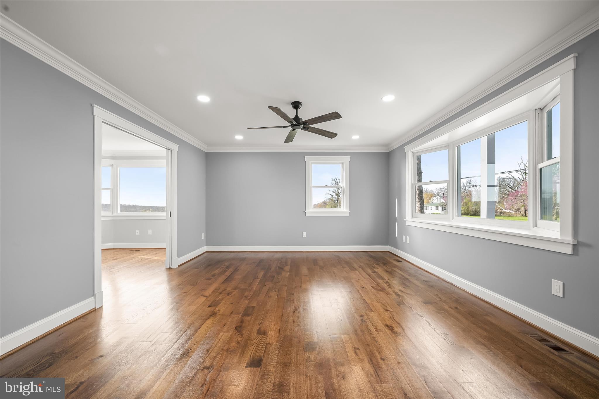 21611 Slidell Road Boyds, MD 20841 - Photo 14 of 84 a view of an empty room with wooden floor and a window