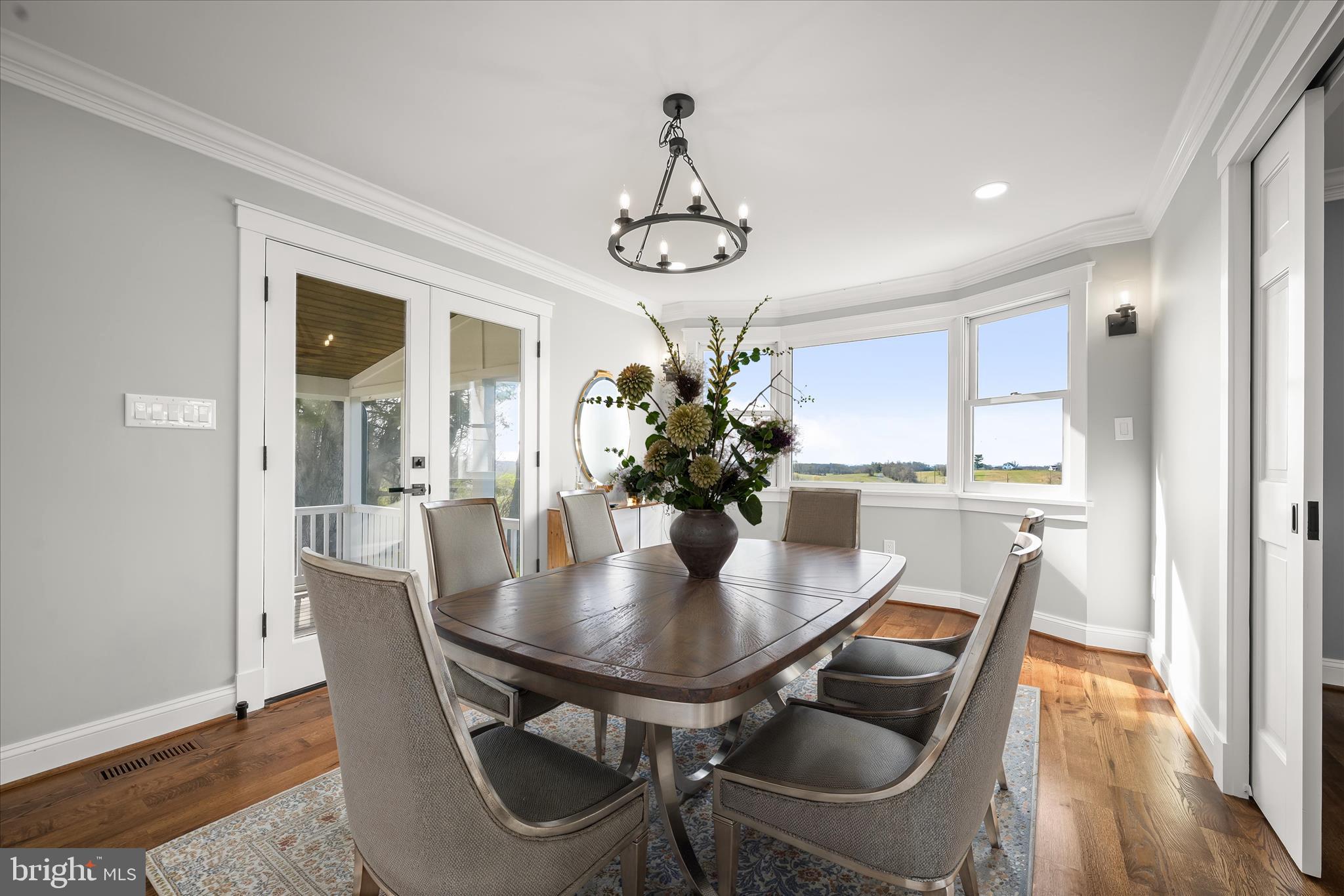 21611 Slidell Road Boyds, MD 20841 - Photo 17 of 84 a view of a dining room with furniture wooden floor and chandelier