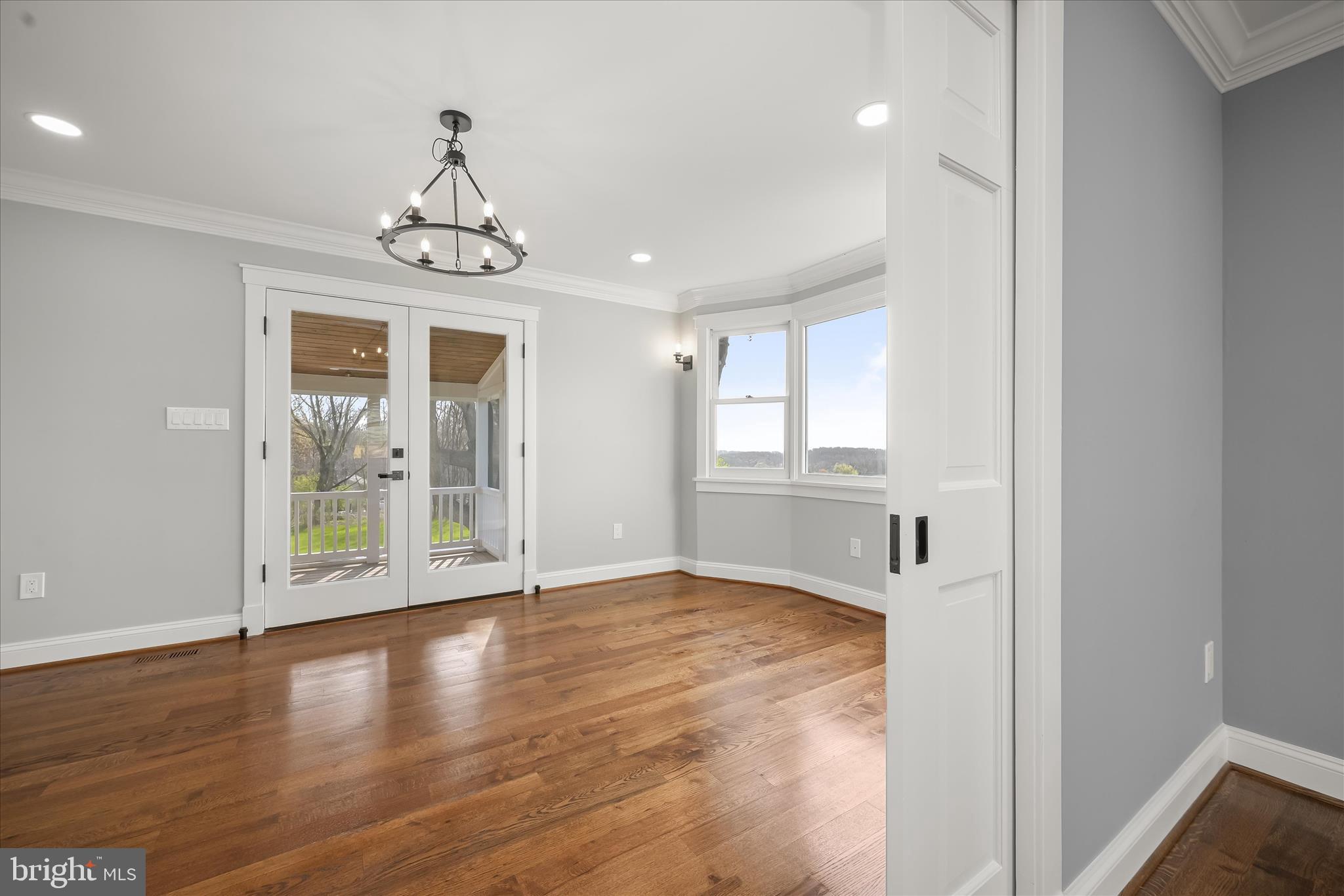 21611 Slidell Road Boyds, MD 20841 - Photo 18 of 84 a view of an empty room with wooden floor and a window