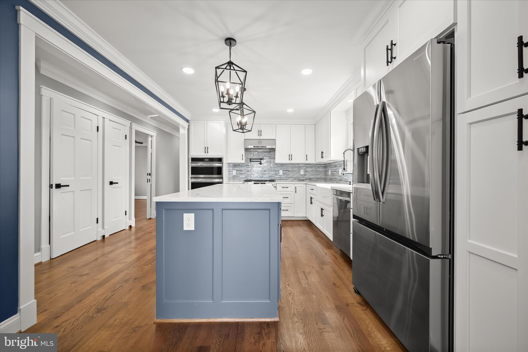 21611 Slidell Road Boyds, MD 20841 - Photo 25 of 84 a kitchen with stainless steel appliances a refrigerator a sink dishwasher a stove and white cabinets with wooden floor