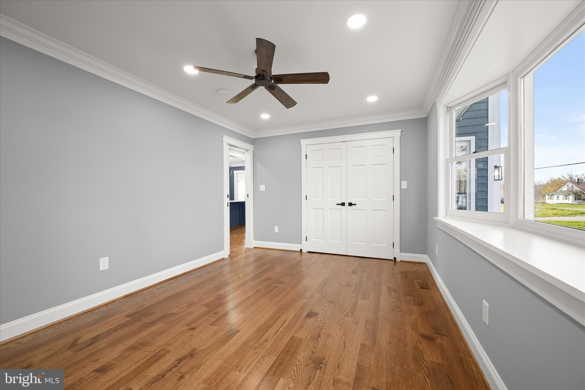 21611 Slidell Road Boyds, MD 20841 - Photo 34 of 84 a view of an empty room with wooden floor and a window
