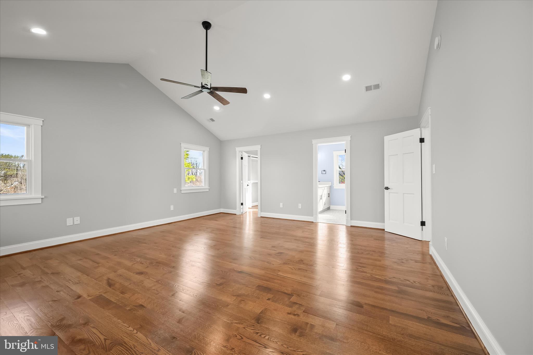 21611 Slidell Road Boyds, MD 20841 - Photo 40 of 84 a view of an empty room with wooden floor and windows