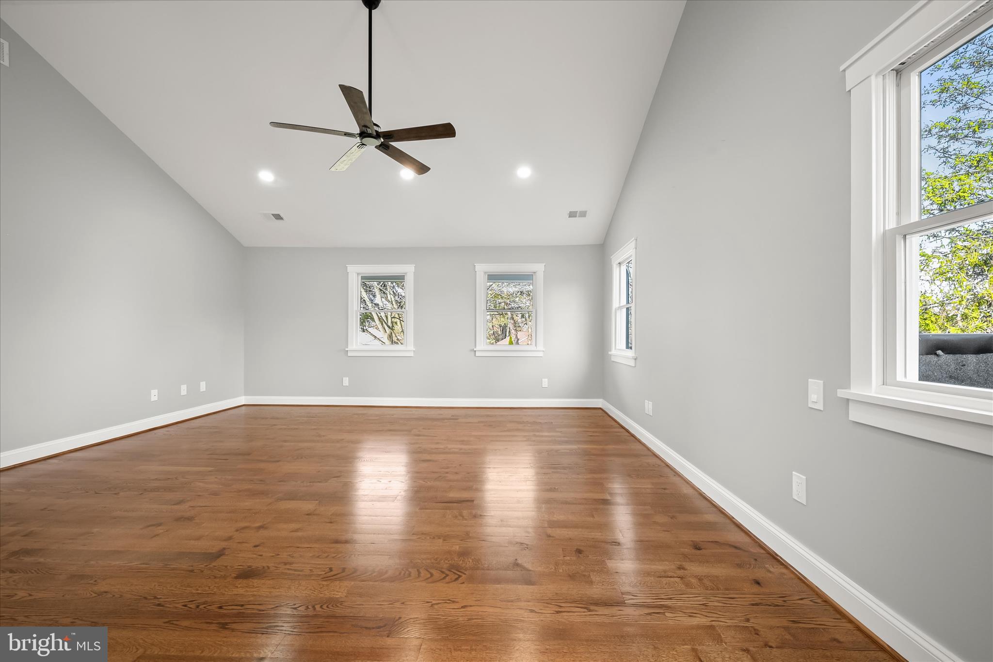21611 Slidell Road Boyds, MD 20841 - Photo 43 of 84 a view of an empty room with wooden floor and a window