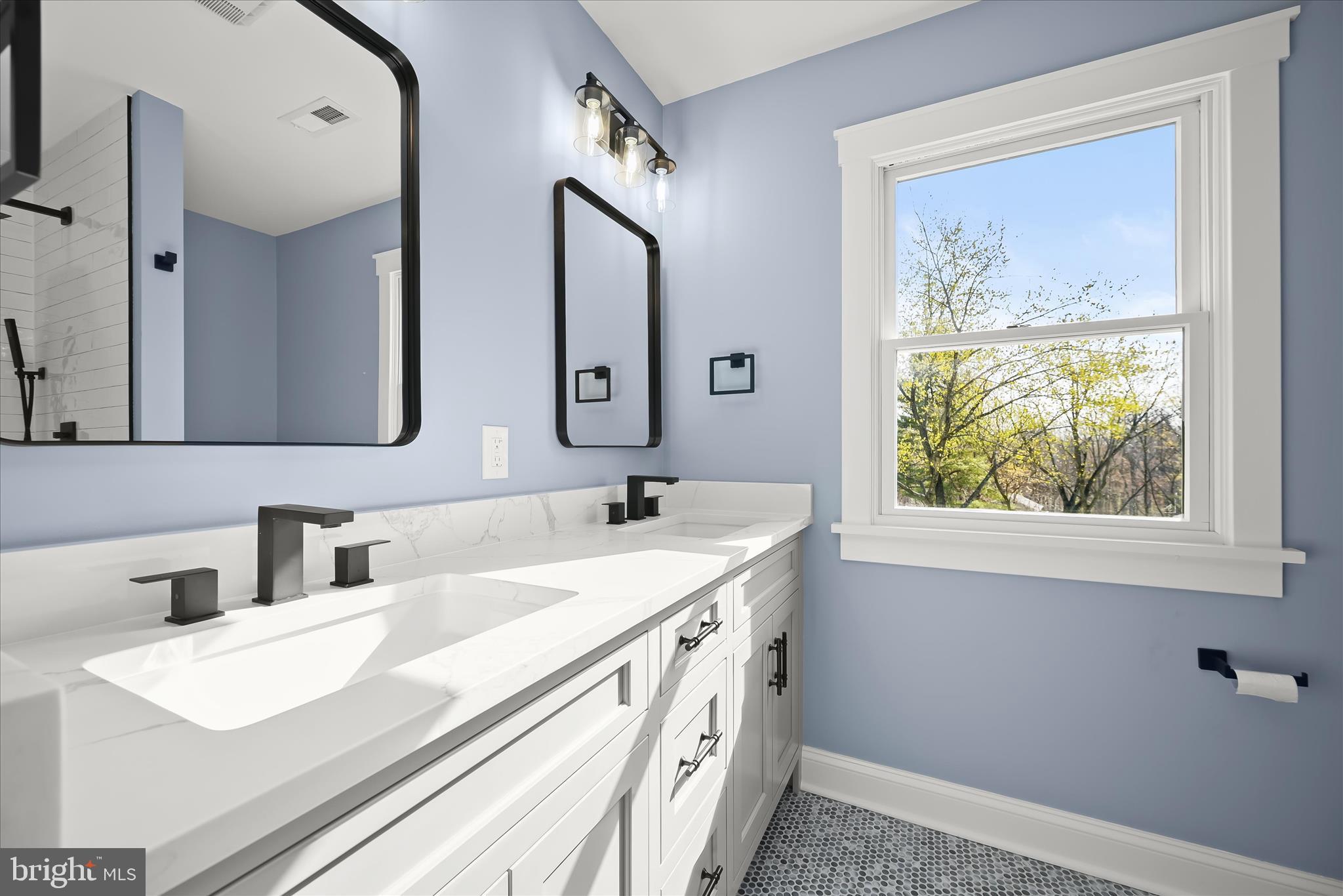 21611 Slidell Road Boyds, MD 20841 - Photo 46 of 84 a bathroom with a sink and a mirror