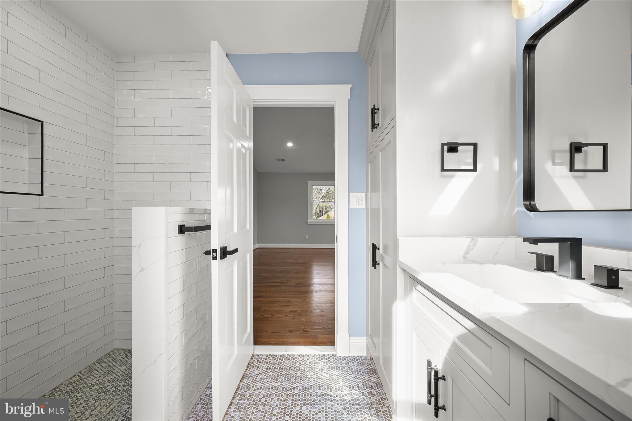 21611 Slidell Road Boyds, MD 20841 - Photo 47 of 84 a bathroom with a sink and a mirror