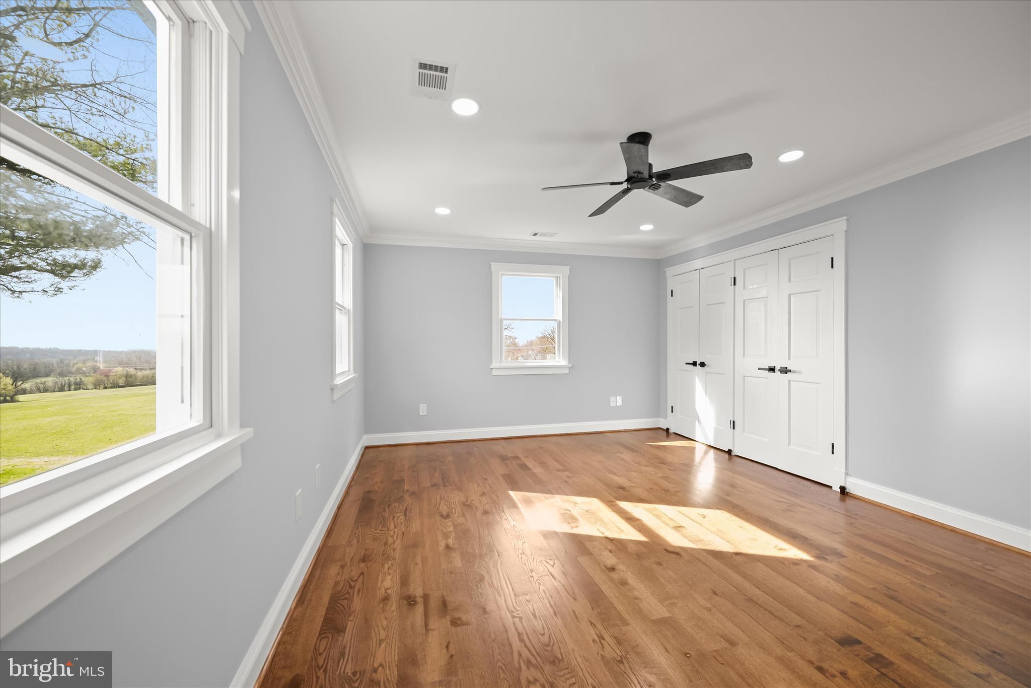21611 Slidell Road Boyds, MD 20841 - Photo 53 of 84 a view of empty room with wooden floor and fan