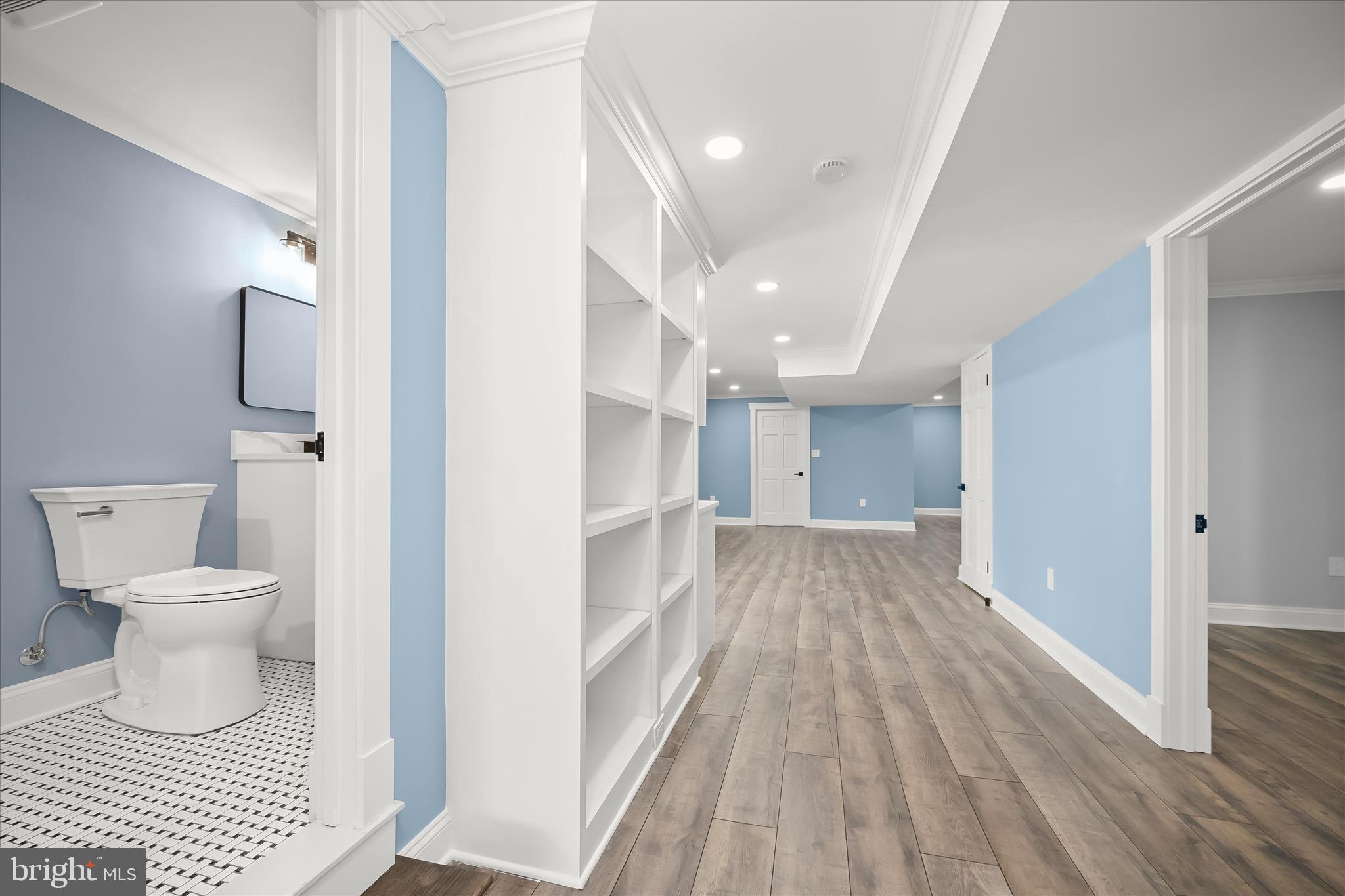 21611 Slidell Road Boyds, MD 20841 - Photo 65 of 84 a view of a hallway with wooden floor and staircase