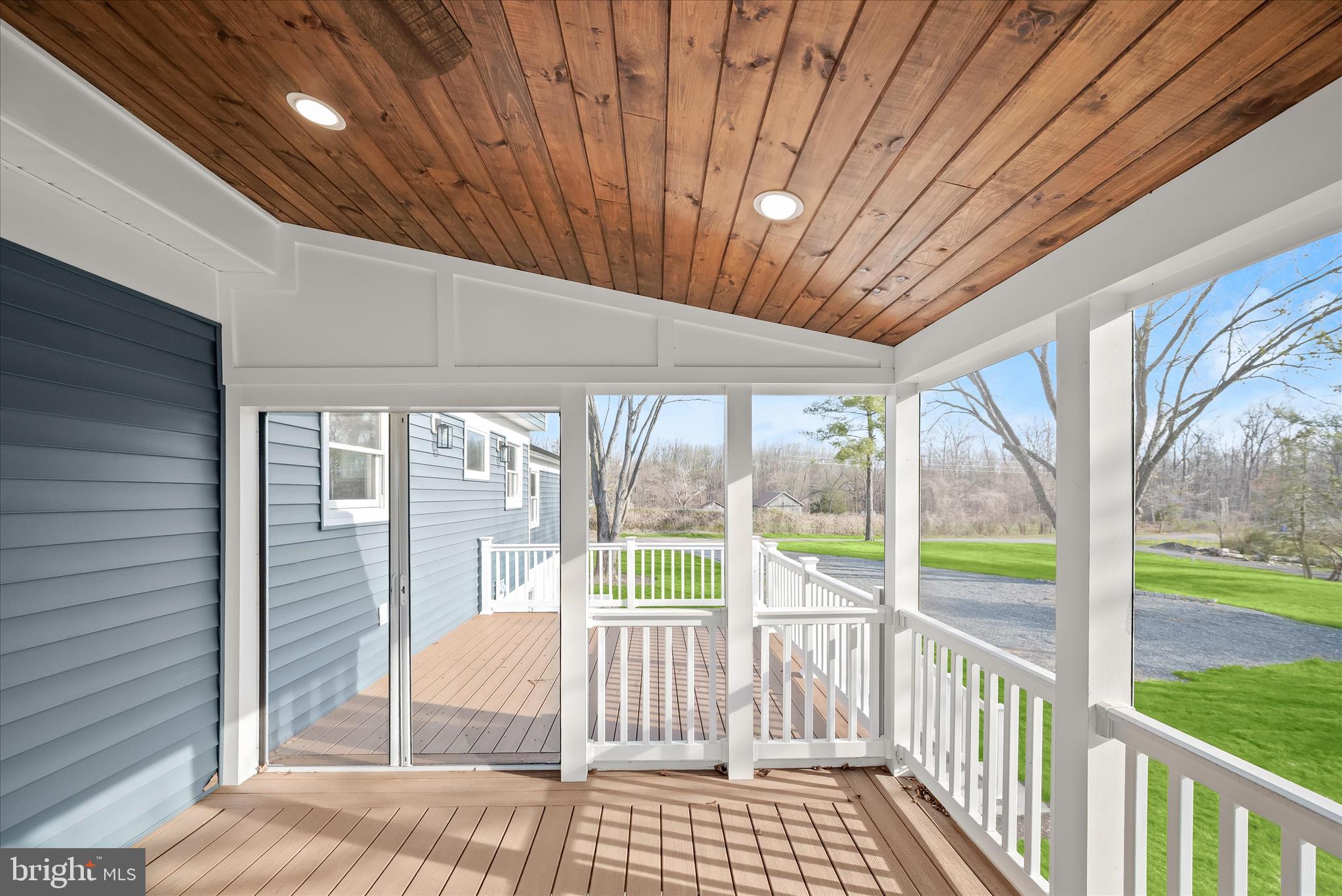 21611 Slidell Road Boyds, MD 20841 - Photo 71 of 84 a view of a porch with wooden floor and iron stairs