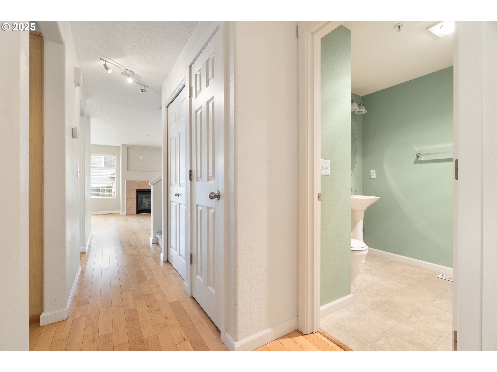 10723 Southwest Canterbury Lane, Unit 102 Portland, OR 97224 - Photo 14 of 30 a view of a hallway with wooden floor