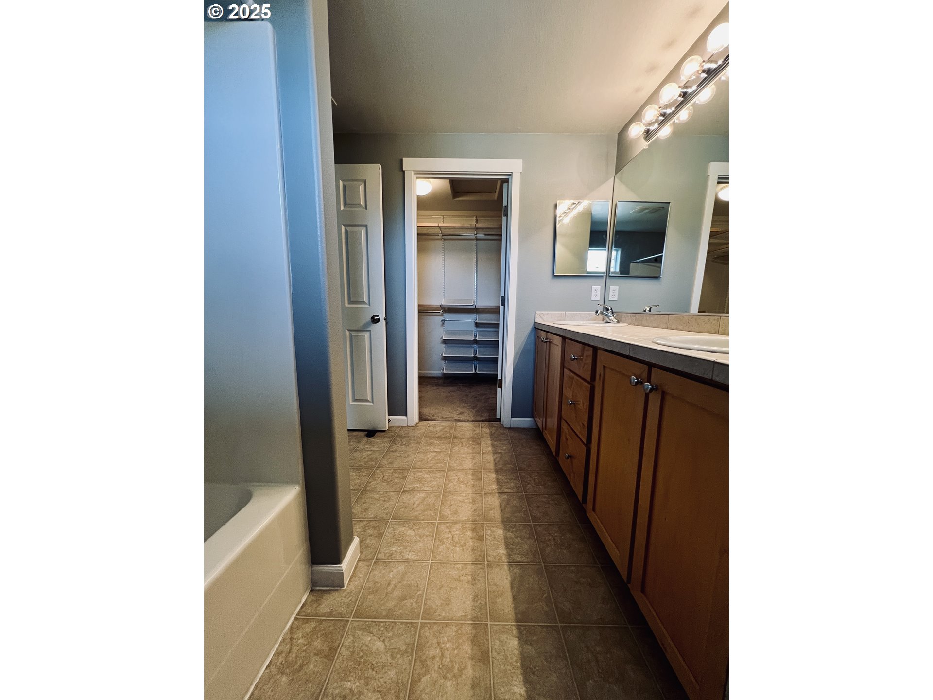 10723 Southwest Canterbury Lane, Unit 102 Portland, OR 97224 - Photo 21 of 30 a view of hallway with sink and cabinets