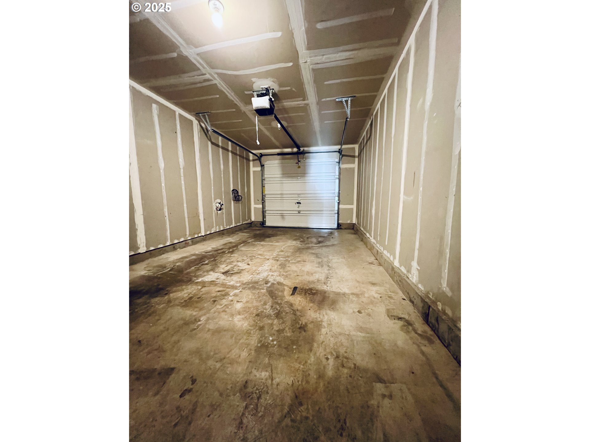 10723 Southwest Canterbury Lane, Unit 102 Portland, OR 97224 - Photo 30 of 30 a view of a garage