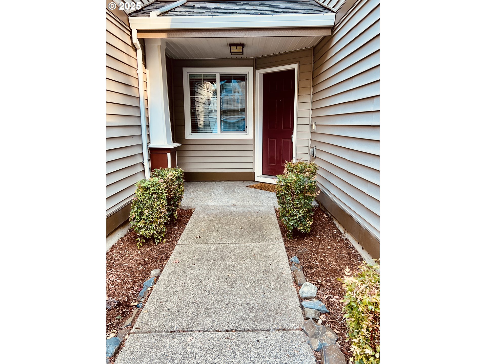 10723 Southwest Canterbury Lane, Unit 102 Portland, OR 97224 - Photo 3 of 30 a view of a pathway with a house