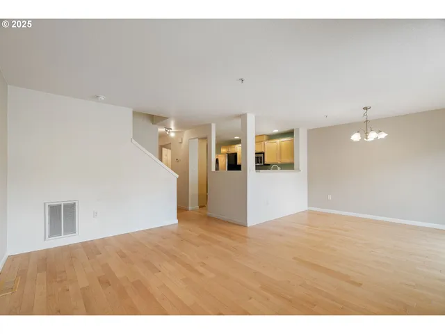 a kitchen with stainless steel appliances granite countertop a sink stove and microwave