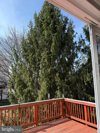 a view of balcony with wooden floor