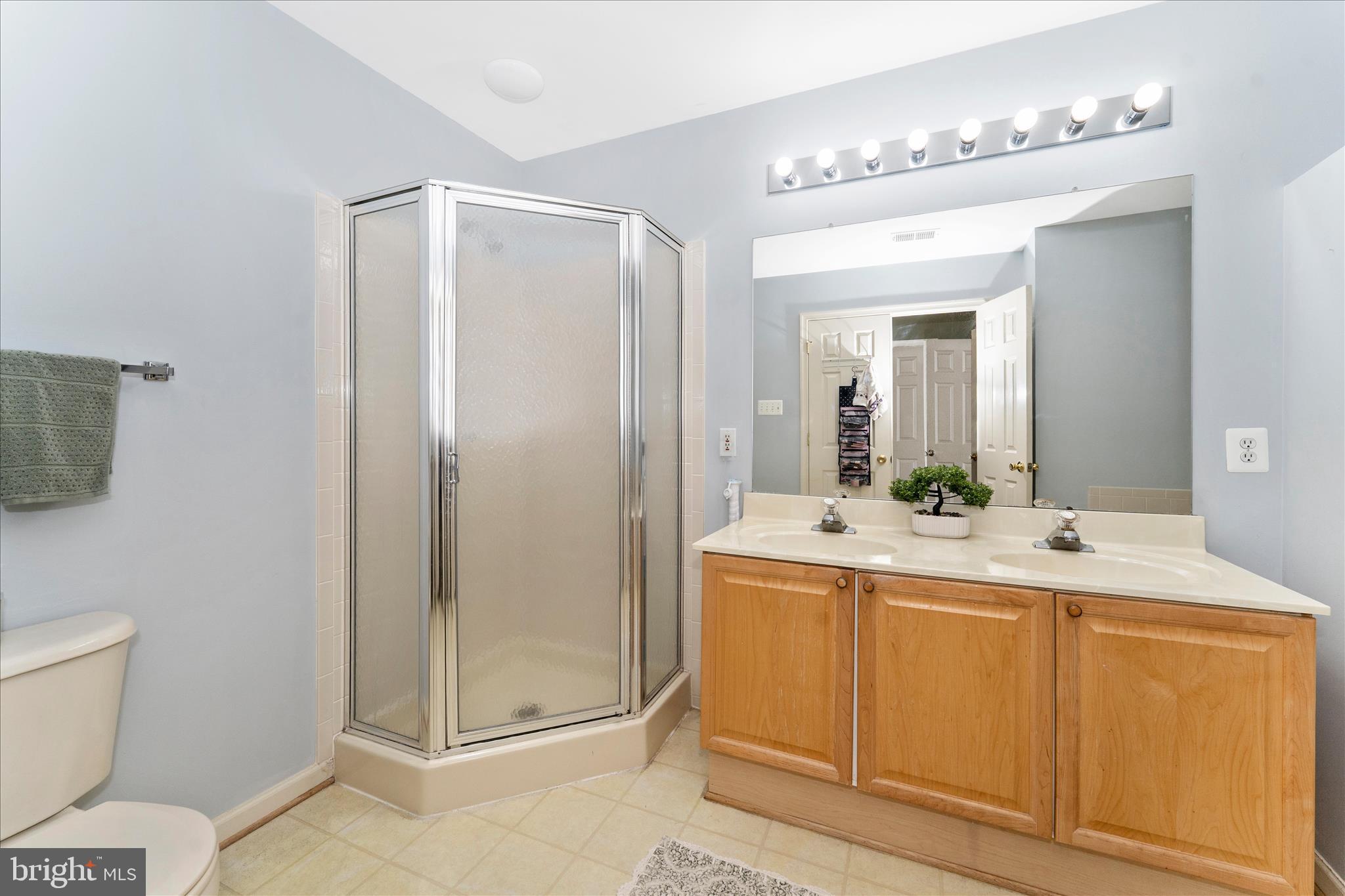 123 Jason's Ridge Smithsburg, MD 21783 - Photo 29 of 57 a bathroom with a double vanity sink mirror and toilet