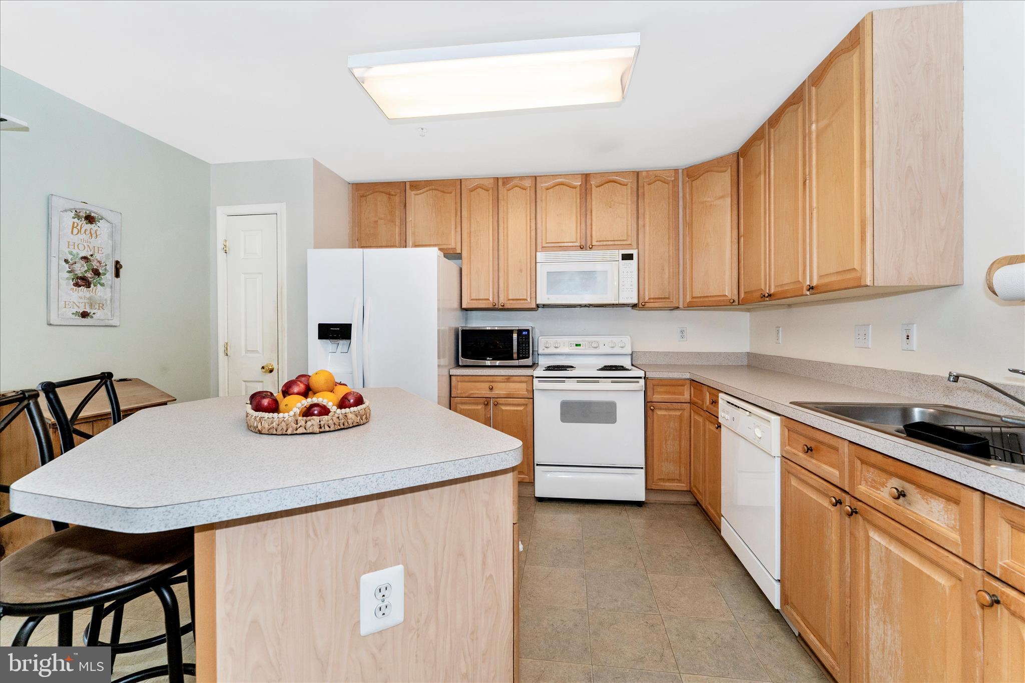 123 Jason's Ridge Smithsburg, MD 21783 - Photo 10 of 57 a kitchen with stainless steel appliances a white table and chairs