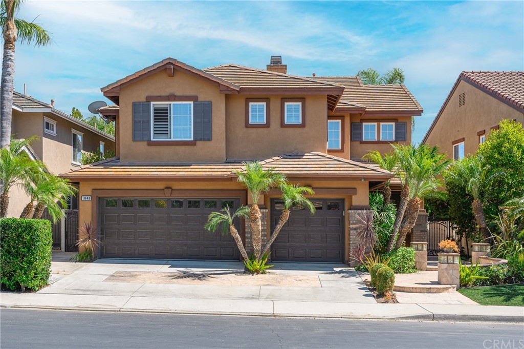a front view of a house with yard