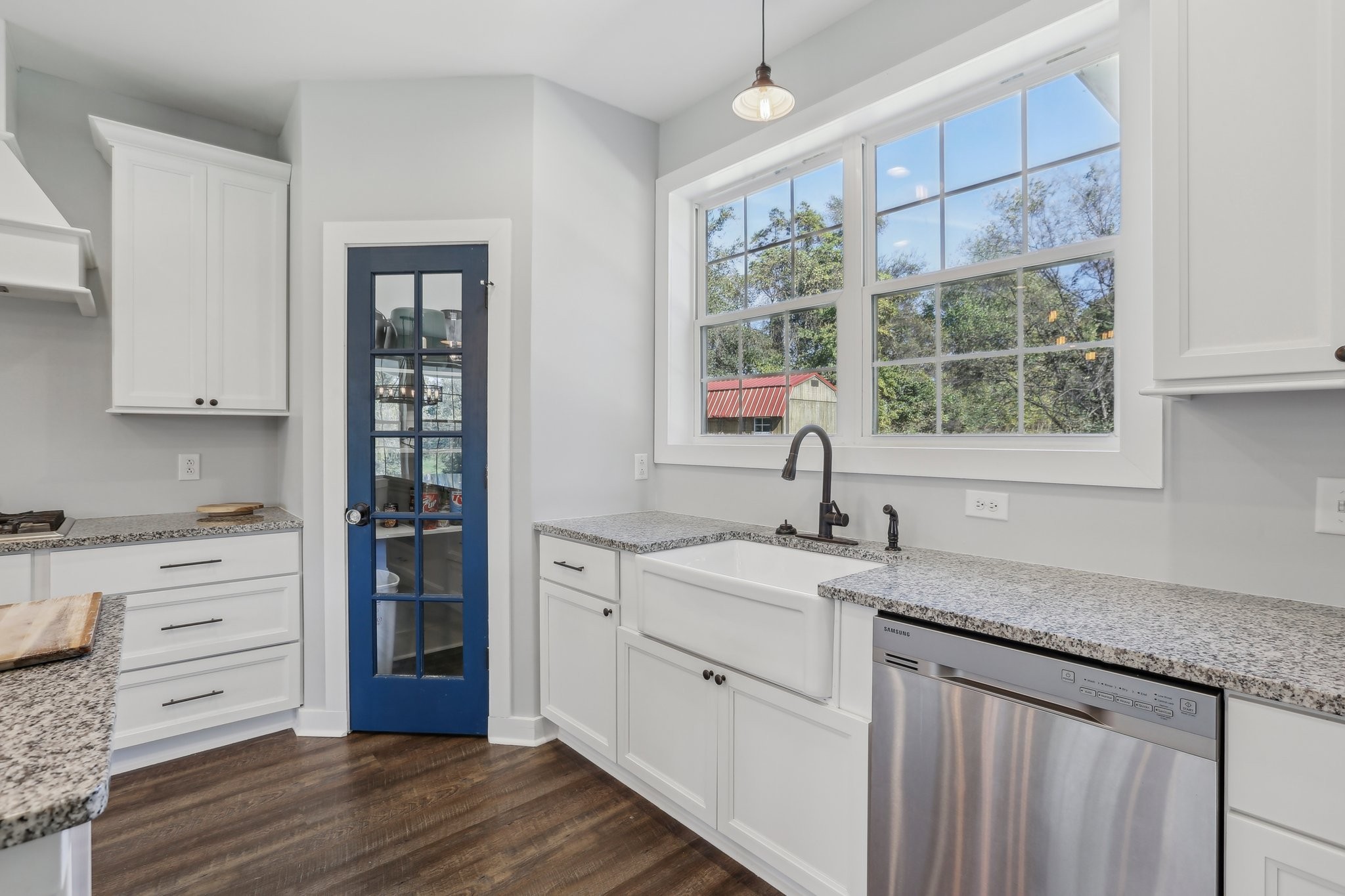 521 Boiling Springs Road Portland, TN 37148 - Photo 20 of 61 a kitchen with granite countertop a sink cabinets stainless steel appliances and a window