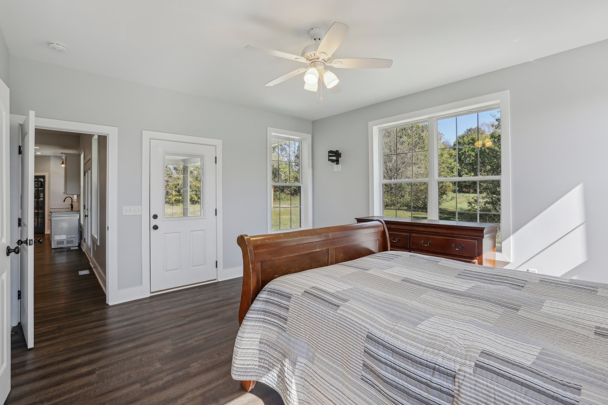 521 Boiling Springs Road Portland, TN 37148 - Photo 31 of 61 a bedroom with a large bed a chandelier and a window