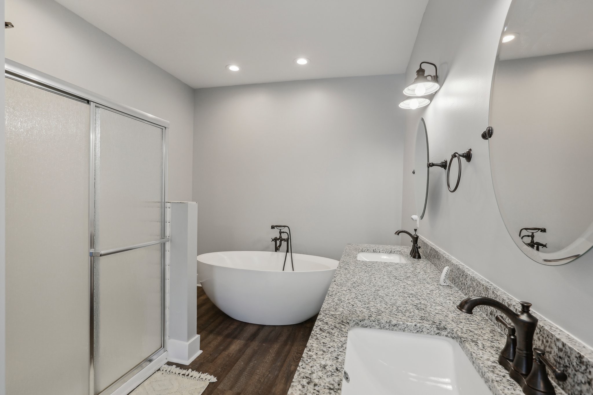 521 Boiling Springs Road Portland, TN 37148 - Photo 32 of 61 a bathroom with a tub sink and mirror