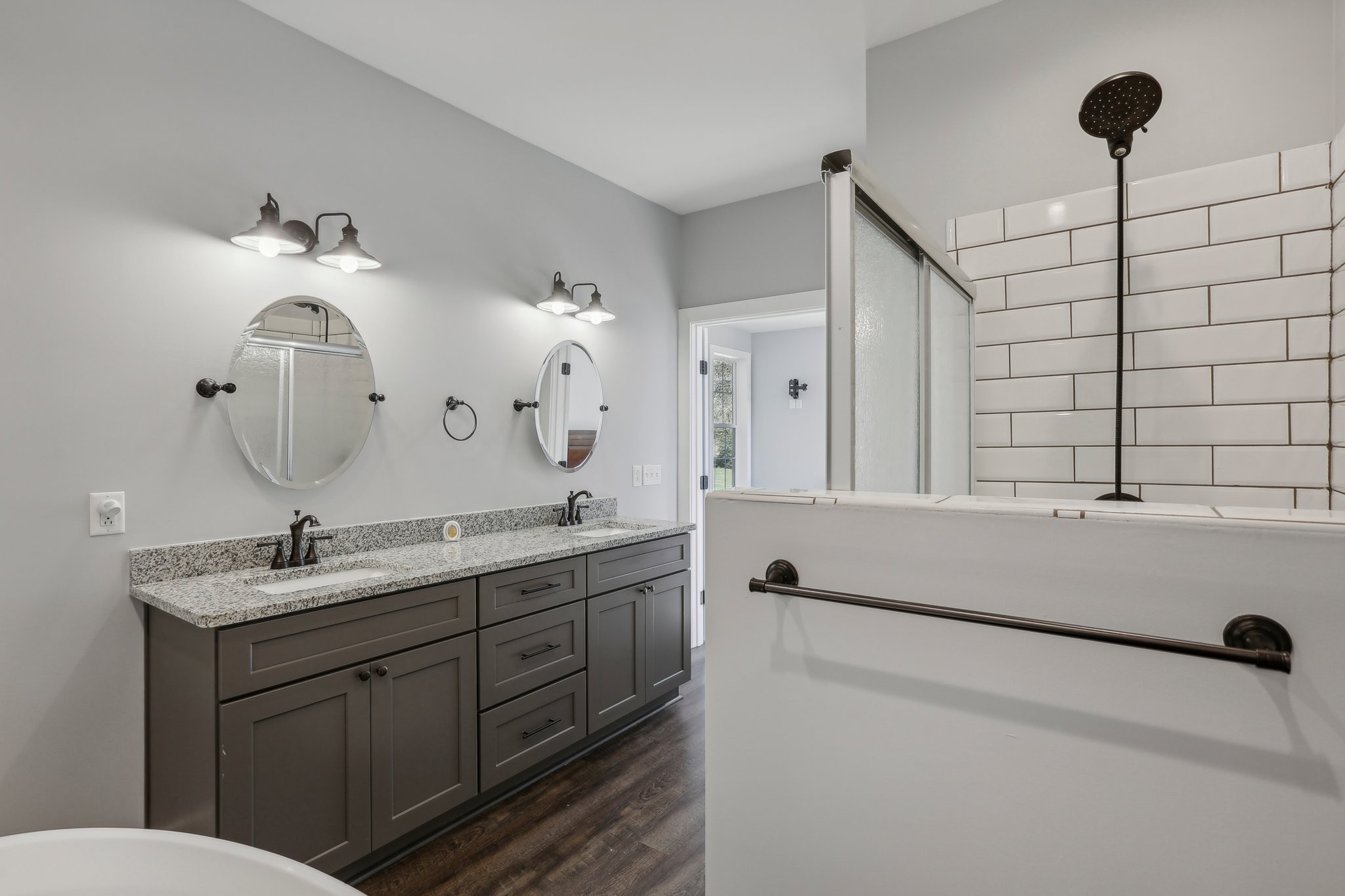 521 Boiling Springs Road Portland, TN 37148 - Photo 34 of 61 a bathroom with a double vanity sink and a mirror