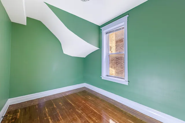 a view of a room that has a window in it